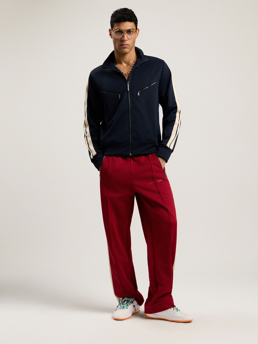 pantalones deportivos con cremallera y logotipo clásico