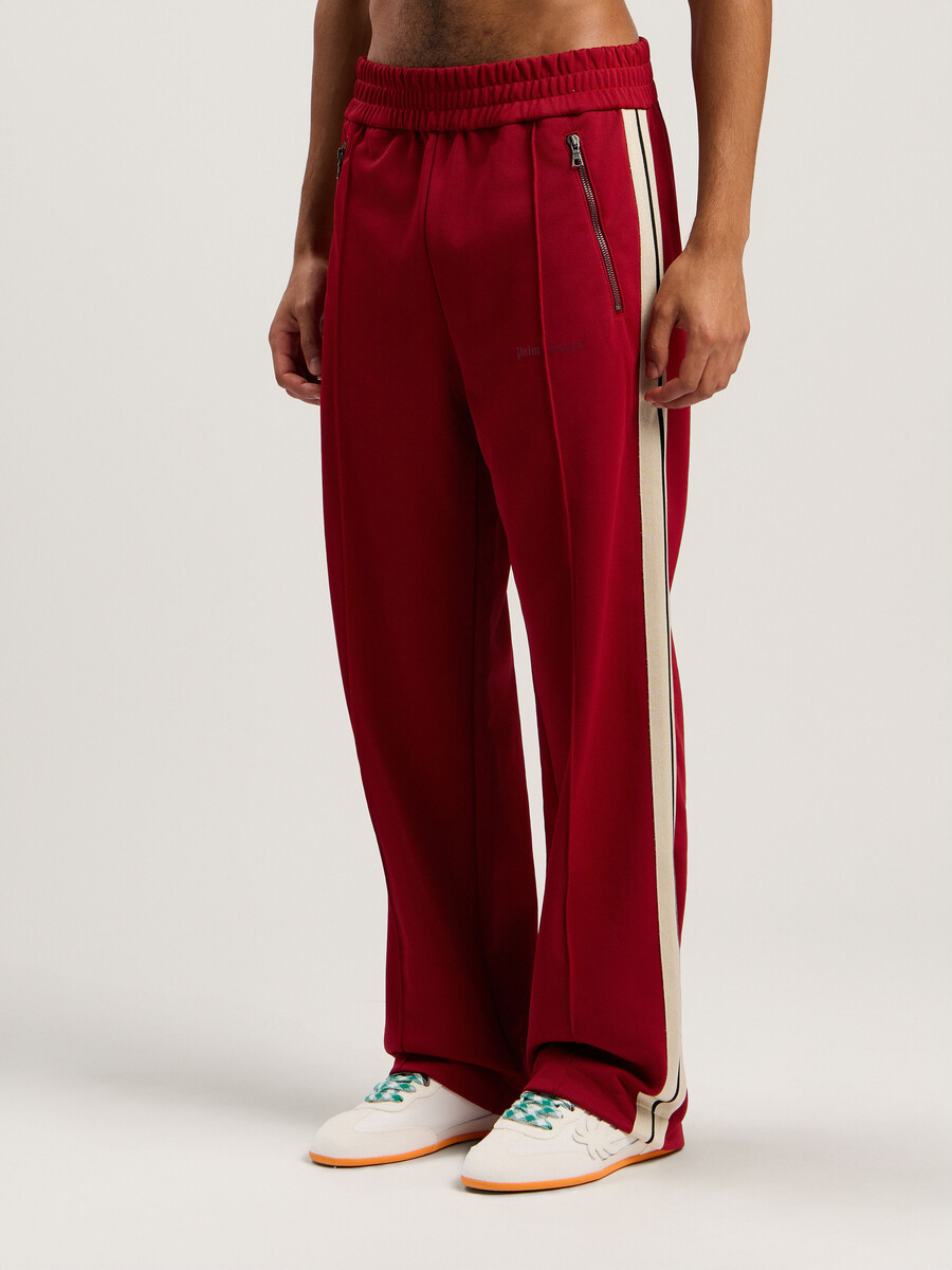 pantalones deportivos con cremallera y logotipo clásico
