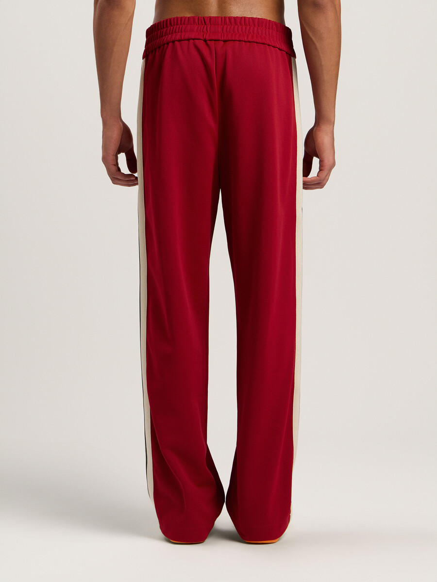pantalones deportivos con cremallera y logotipo clásico