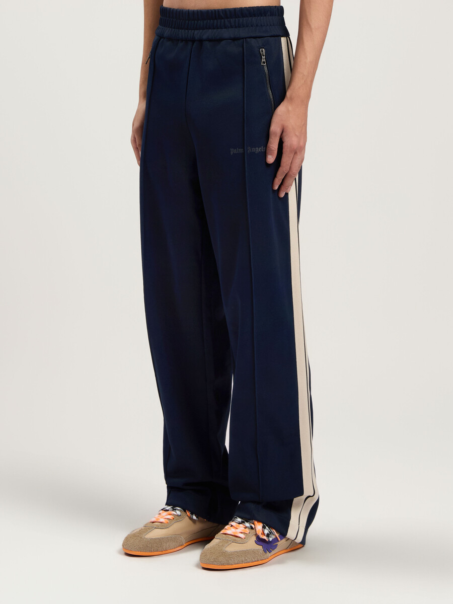 pantalones deportivos con cremallera y logotipo clásico
