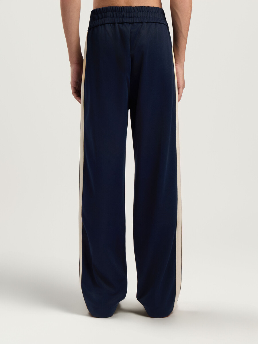 pantalones deportivos con cremallera y logotipo clásico