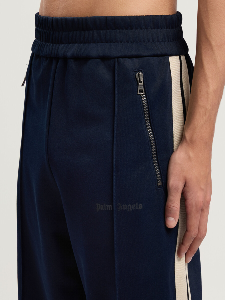 pantalones deportivos con cremallera y logotipo clásico