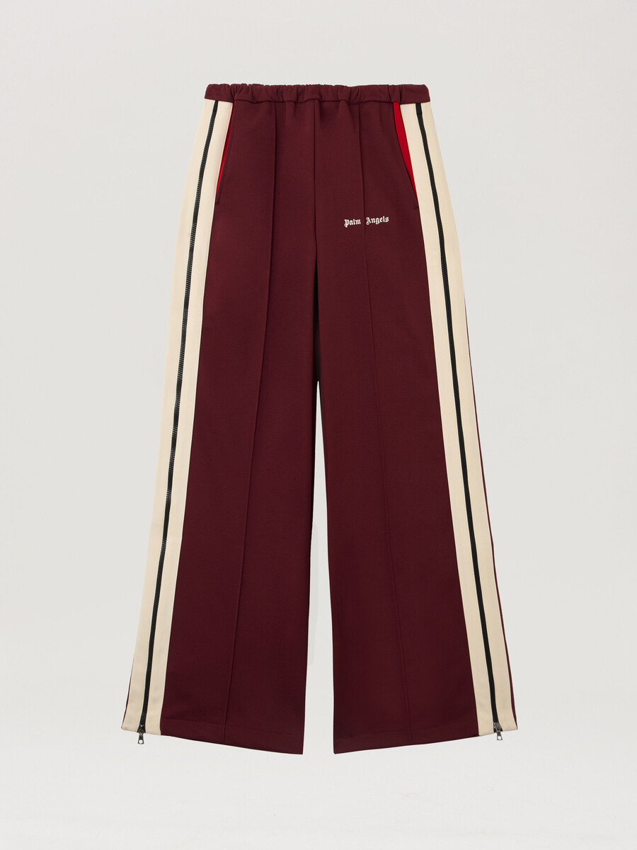 pantalones deportivos con cremallera y bloques de color