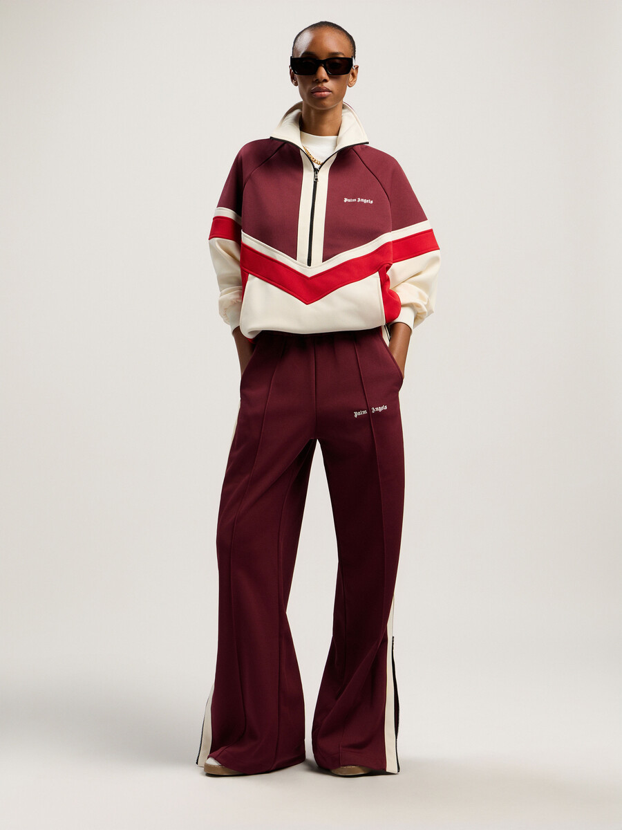 pantalones deportivos con cremallera y bloques de color