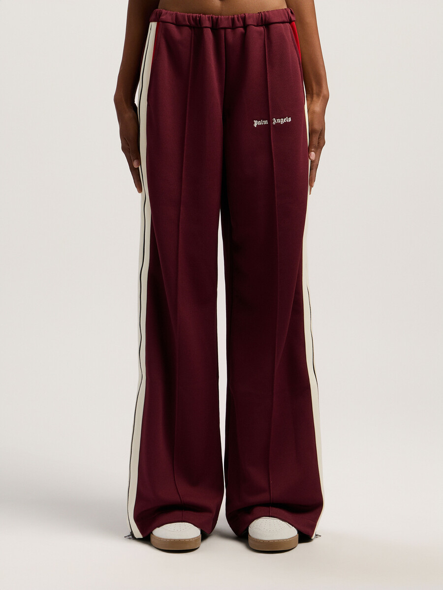 pantalones deportivos con cremallera y bloques de color