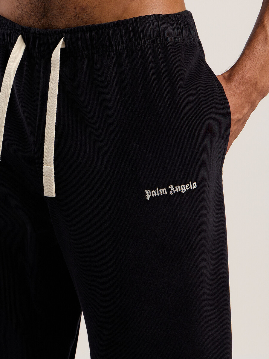 pantalones de viaje de pana con logotipo clásico
