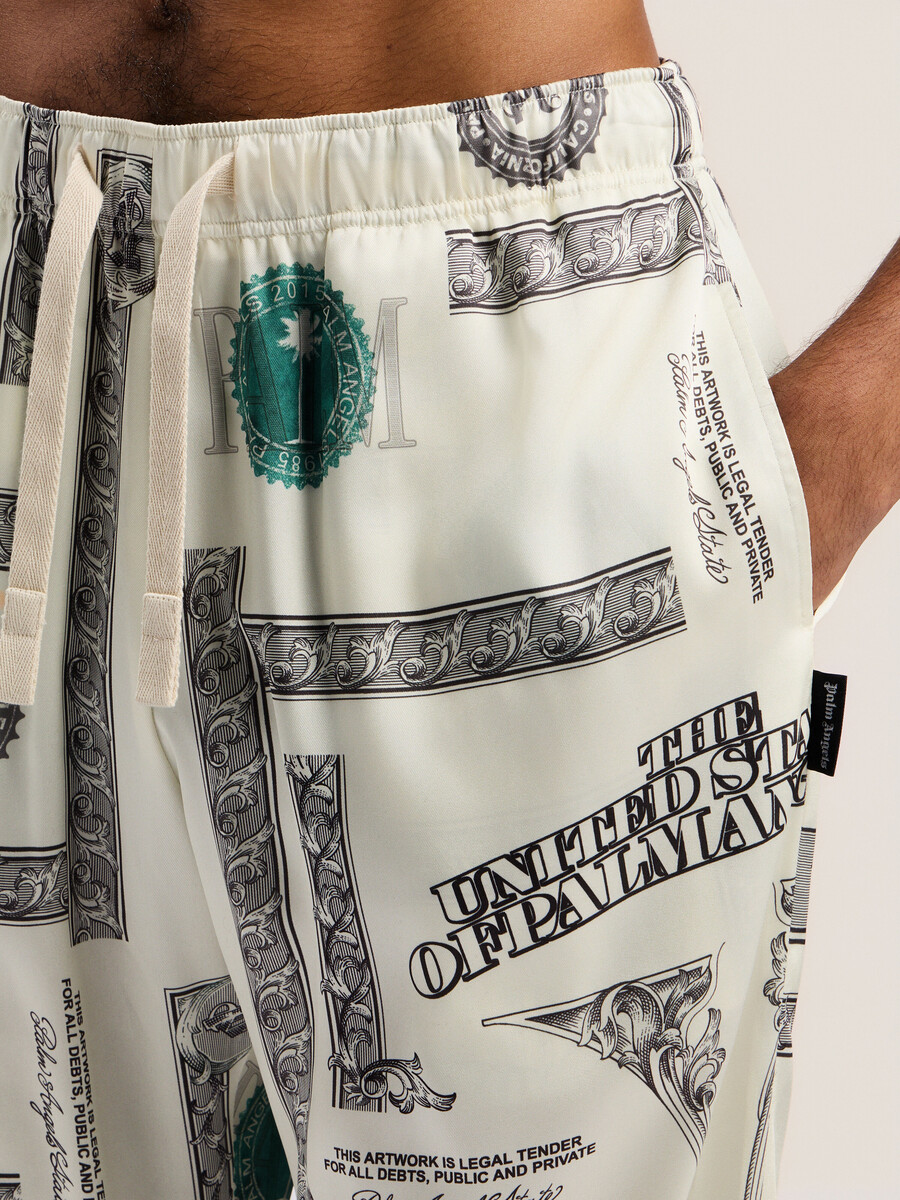 pantalones anchos con estampado de dólares