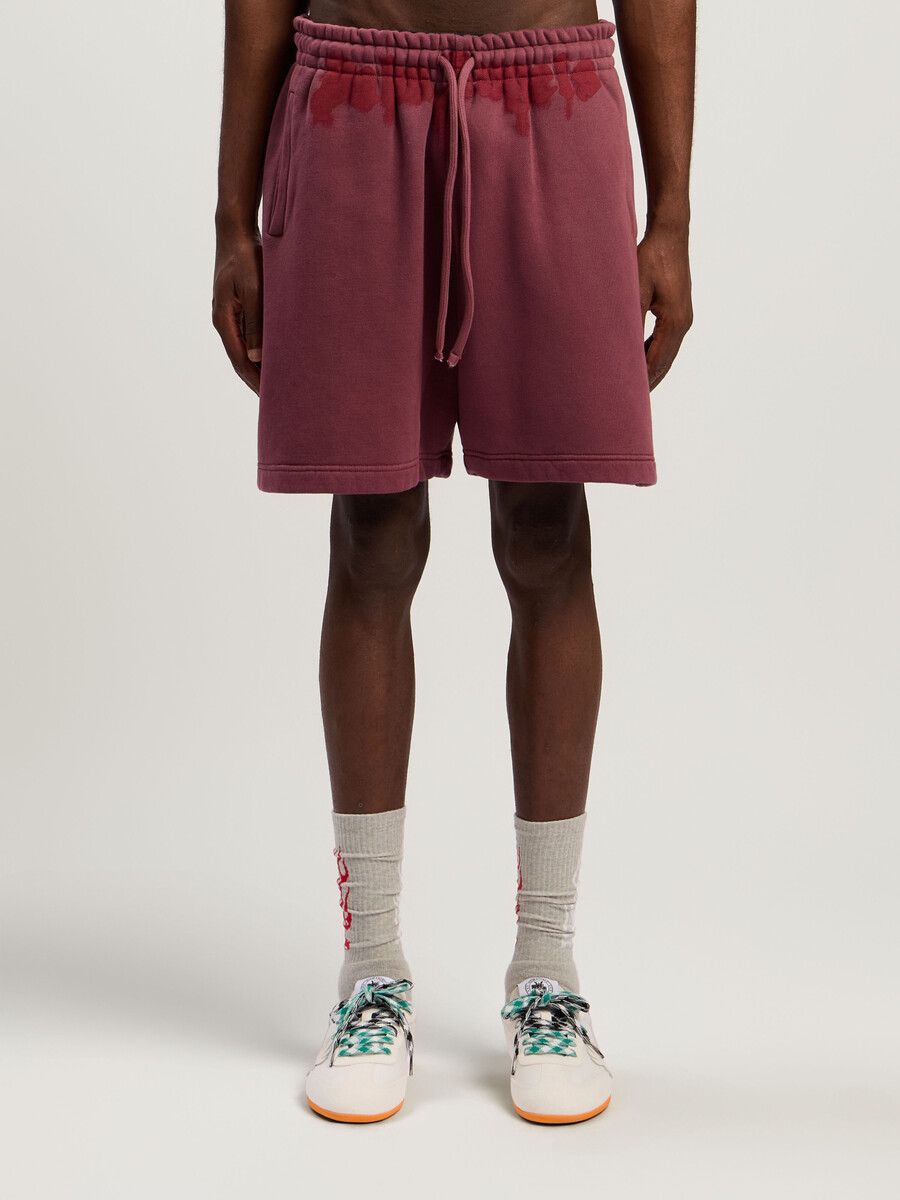 pantalones cortos deportivos con logo en la cintura rociado
