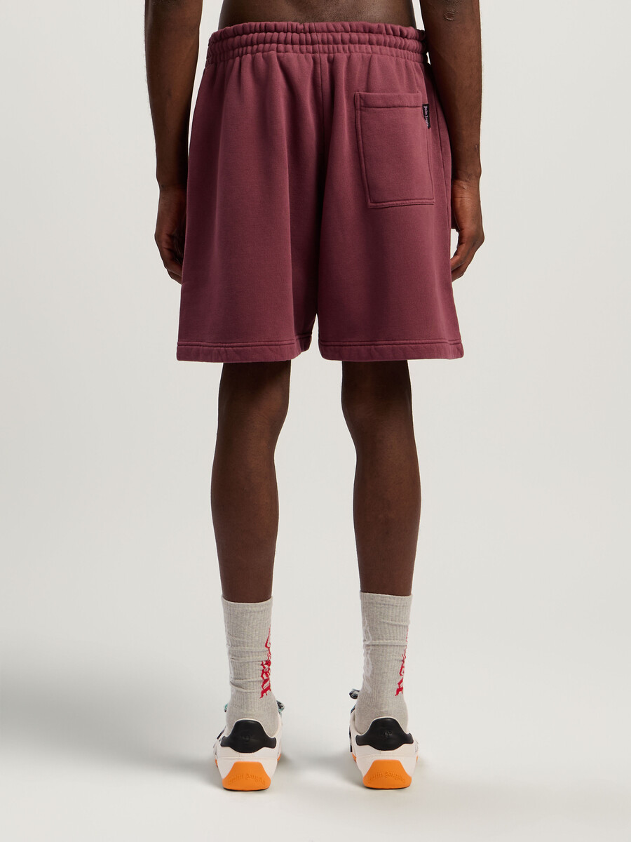 pantalones cortos deportivos con logo en la cintura rociado