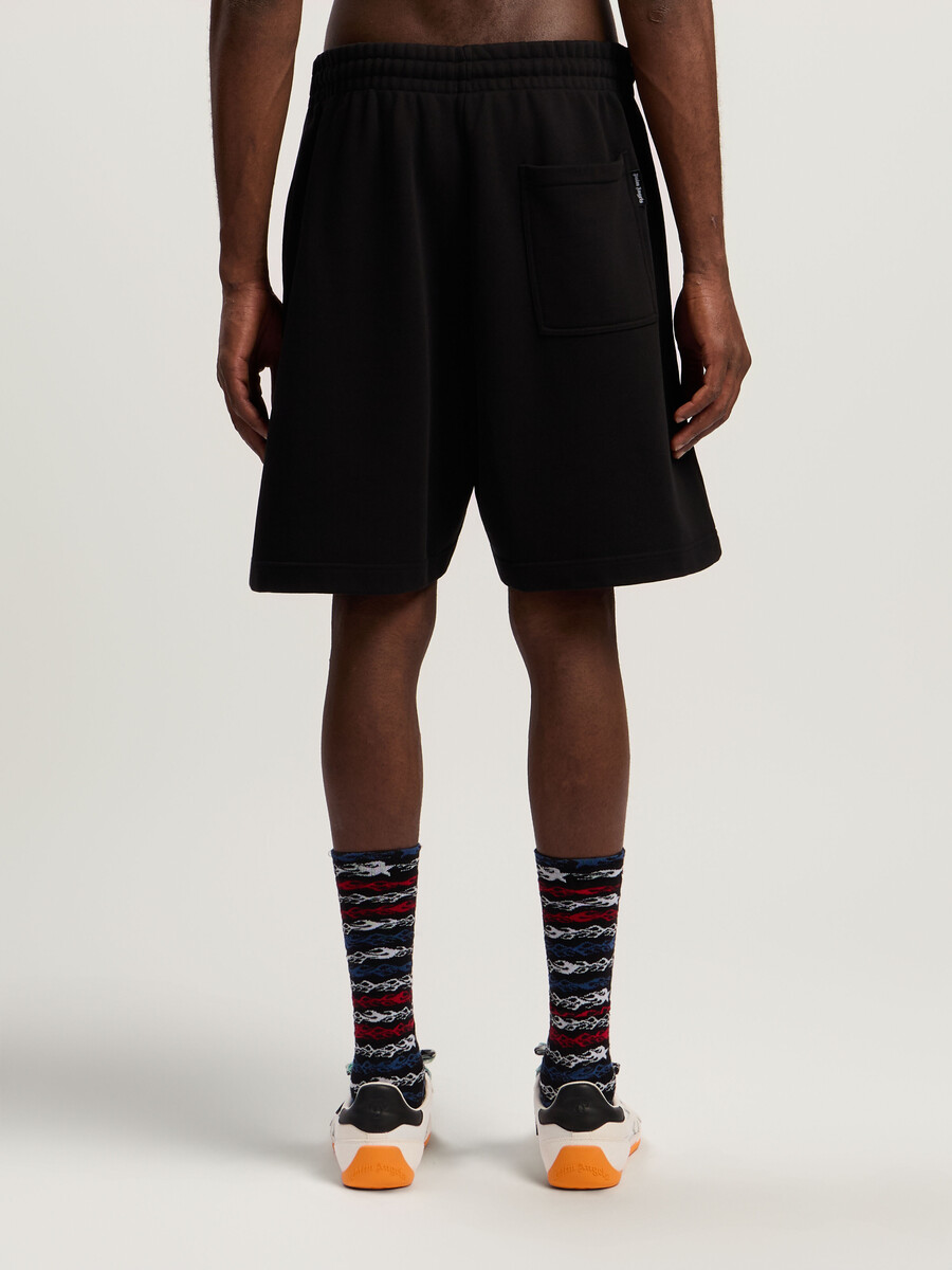 pantalones cortos deportivos con logotipo rociado