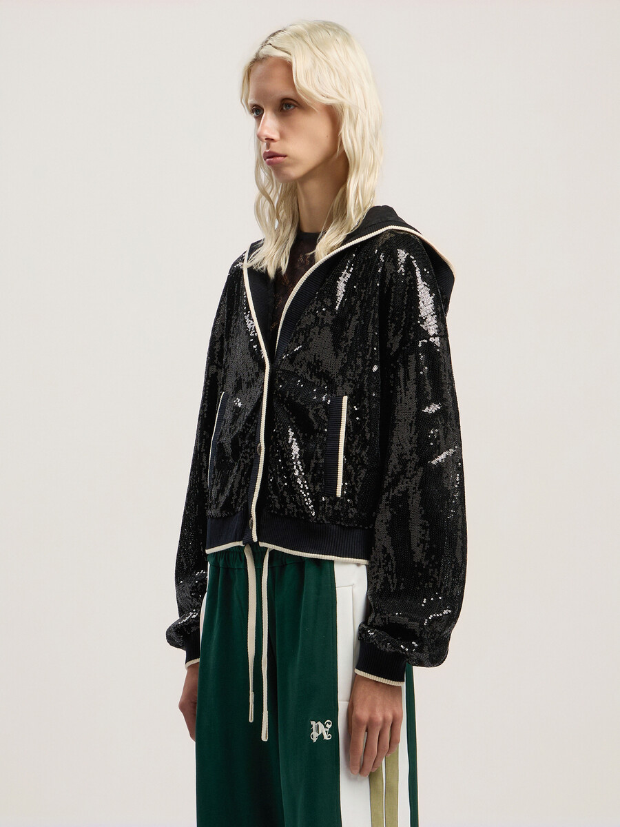 chaqueta corta con lentejuelas y logotipo curvo