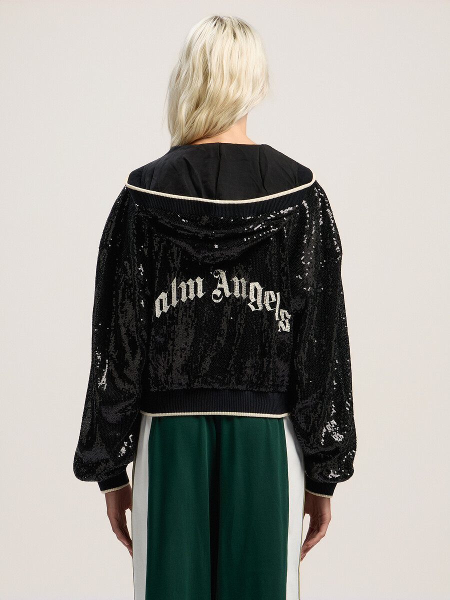 chaqueta corta con lentejuelas y logotipo curvo
